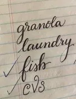 Granola, laundry, fish and CVS written in flowing cursive on lined paper